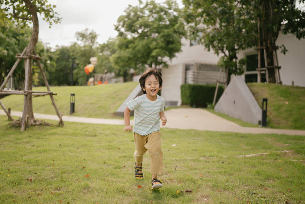 istock Happy littler boy in garden. 1318684809
