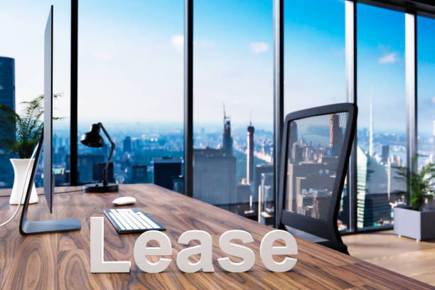 istock housebuilding; office chair in front of modern workspace with computer and skyline view; lease concept; 3D Illustration 1318686178