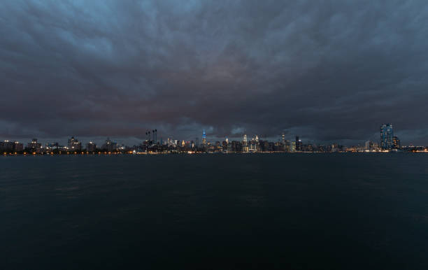 istock NYC Cityscape with Stormy Cloudy Blue Sky in Background 1318687526