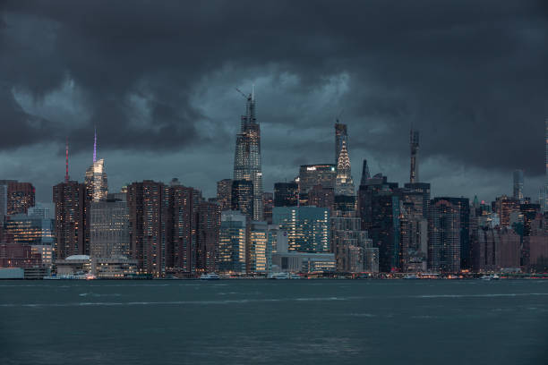 istock NYC Cityscape with Stormy Cloudy Blue Sky in Background 1318688303