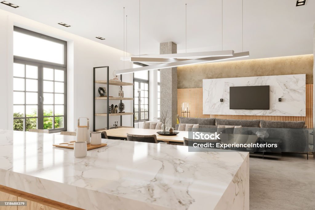 Modern open plan apartment interior Modern open plan apartment kitchen and dining room interior. Marble countertop, wooden dining table, chairs, pillars, shelf, windows, wooden wall, pendant lamp and TV set in the background. Copy space template. Render. Kitchen Stock Photo
