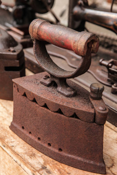 istock Old Cast Iron on the wooden table. 1318688925