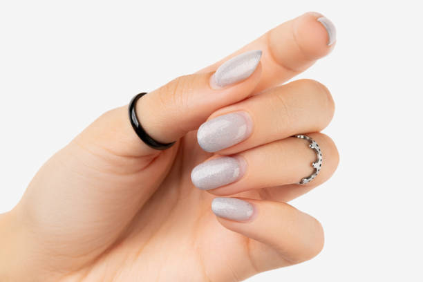 istock Womans hand with grown manicure on white background with copy space 1318688942