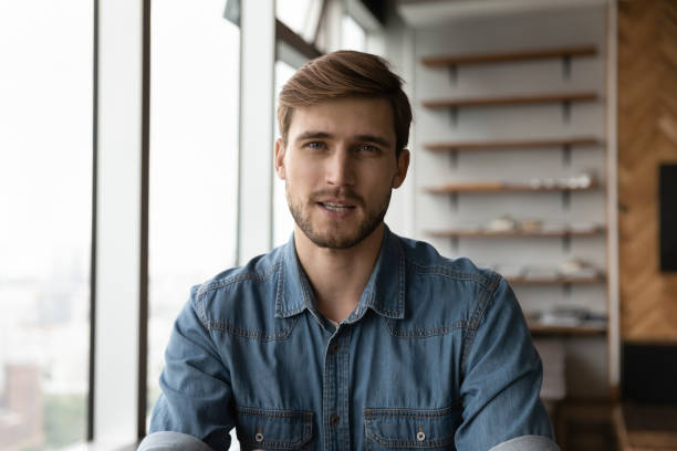 istock Portrait of young man talk on webcam video call 1318692320