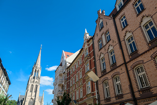 Katowice - Una vista de la calle Mariacka en Katowice, Polonia. Al final de la calle hay una iglesia, con campanario muy alto photo