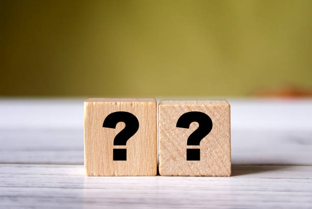 istock Quiz concept symbol with question mark on wooden cube blocks. Support or questionnaire background pattern 1318694749