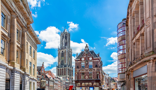 panoramic view over the roofs of Frankfurt city with modern skyline in the background and historic town in the foreground under blue sky, stitched image