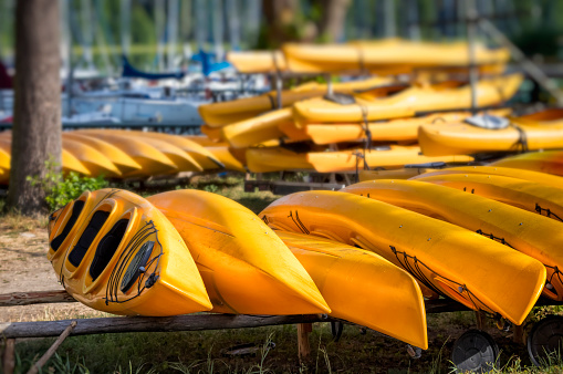 Holidays in Poland - Row of canoes waiting for tourists at marina in Wdzydze Kiszewskie, Kashubia land