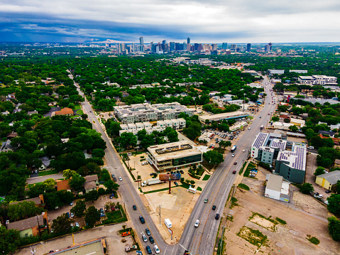 Urban Austin Texas USA Aerial Drone views above South Lamar with two streets leading towards Downtown urban Skyline Cityscape capital cities