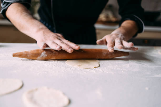 istock Anonymous Male Caucasian Professional Chef Preparing Tasty Meals in a Private Kitchen 1318705995