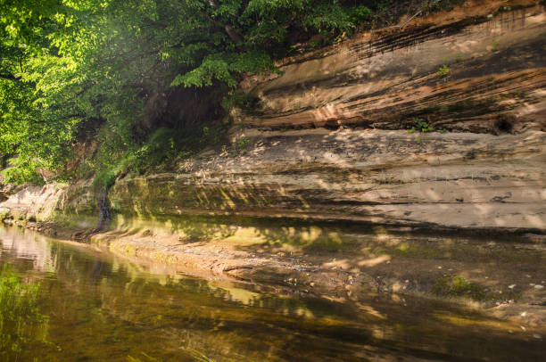 istock Boat trip down the river Abava. Beautiful sand stone cliffs, Latvia 1318706609