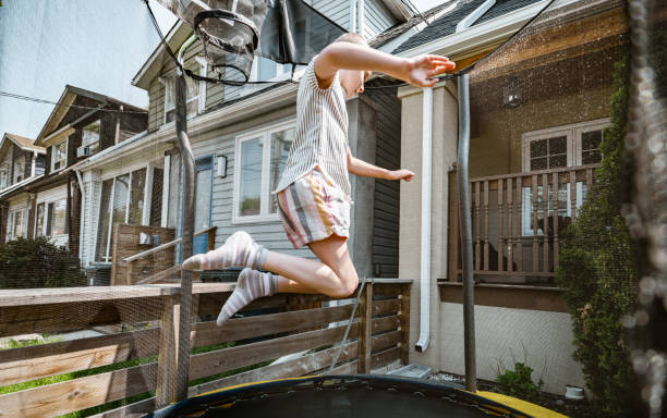 istock Young girl playing on trampoline 1318708628