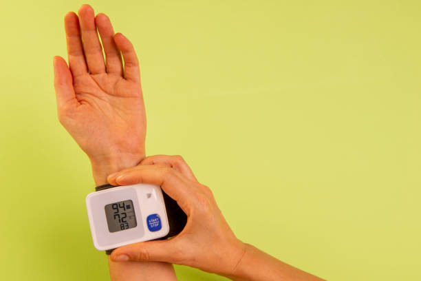 istock woman's hand measuring her blood pressure 1318711417