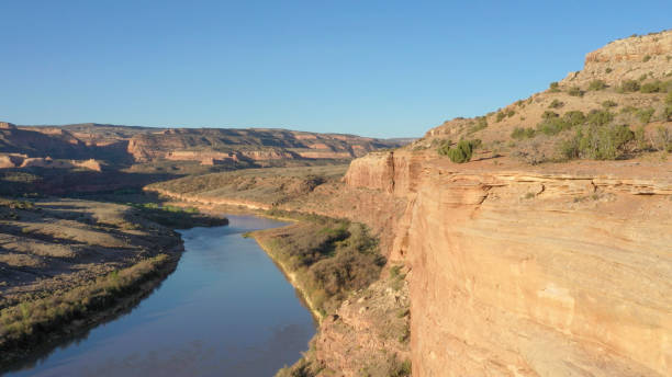 istock Aerial view down river flowing through canyon lands 1318716251