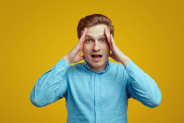 istock Desperate young male has headache and going to scream 1318717190