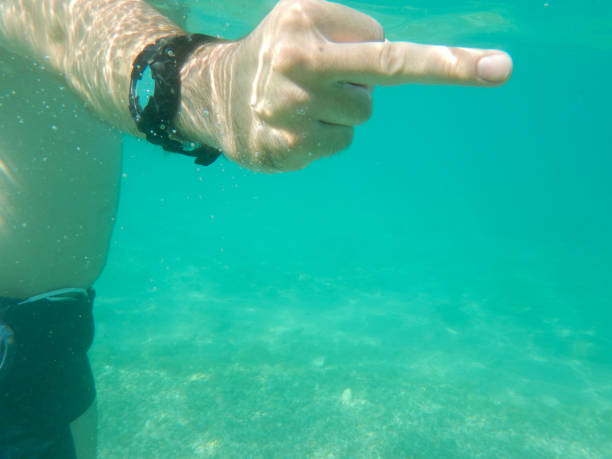 istock Middle finger at Underwater stock photo 1318717213