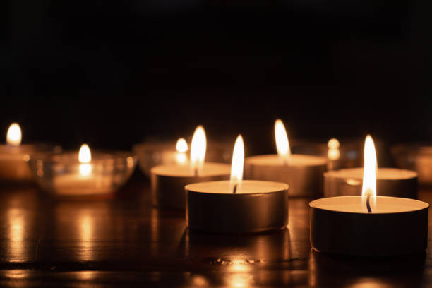 istock many candles burning in the dark 1318717912