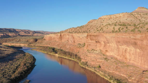 istock Aerial view down river flowing through canyon lands 1318717978