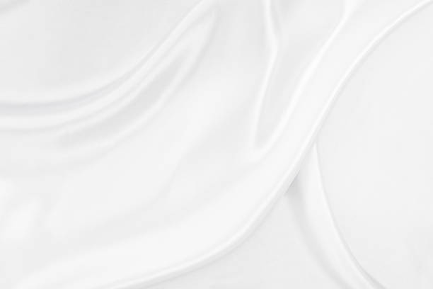 istock White gray satin texture that is white silver fabric silk background with beautiful soft blur pattern natural. 1318724893