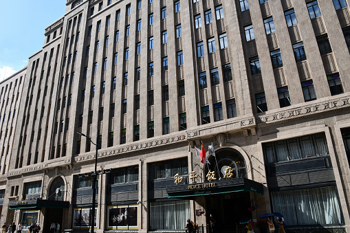 Shanghai, China - September 19, 2019: Entrance of the Fairmont Peace Hotel, a luxury hotel just off the Bund.