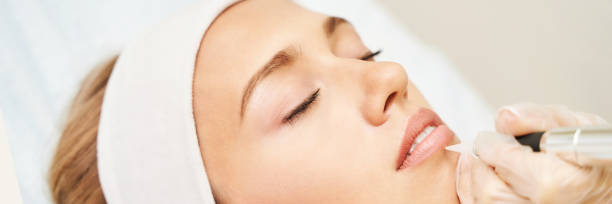 istock Permanent makeup. Beauty spa procedure. Young woman. Face tattoo 1318737044