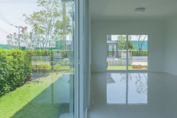 istock Empty room with glass window frame house interior on concrete wall 1318737944