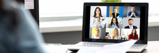 istock Woman talking with international colleagues using online video chat service 1318737996