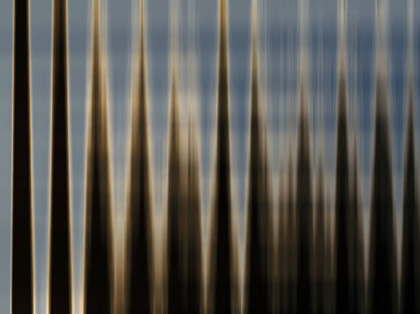 Abstract background with blue and brown pointed lines vertically vector image Taper shaped illustration abstract art background. Soft light blue and dark brown colors vector backgrounds. Pattern with symmetric geometric ornament. corrugated metal fence ideas stock pictures, royalty-free photos & images