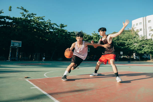 istock Playing basketball with friends 1318752680