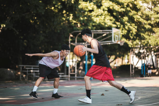 istock Playing basketball with friends 1318753627