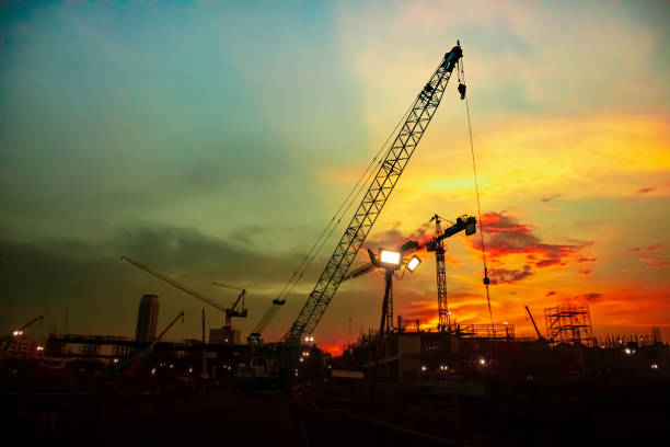 istock tower crane on construction site at evening sunset there are red sky. 1318761007