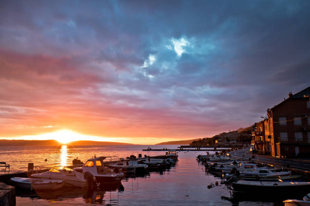 istock Town of Karlobag in Velebit colorful sunset panoramic view 1318762079