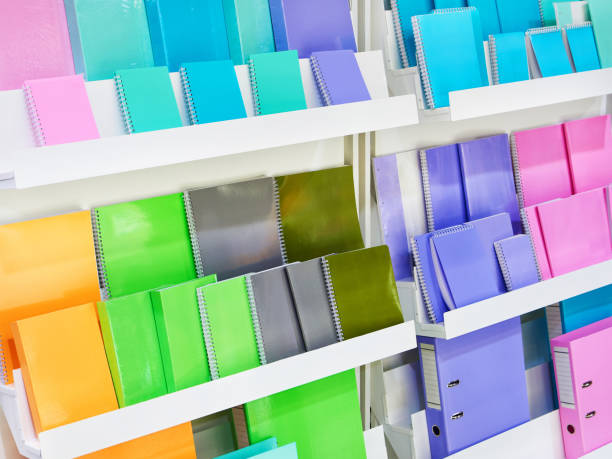 istock Colorful notebooks on shelf in store 1318765163