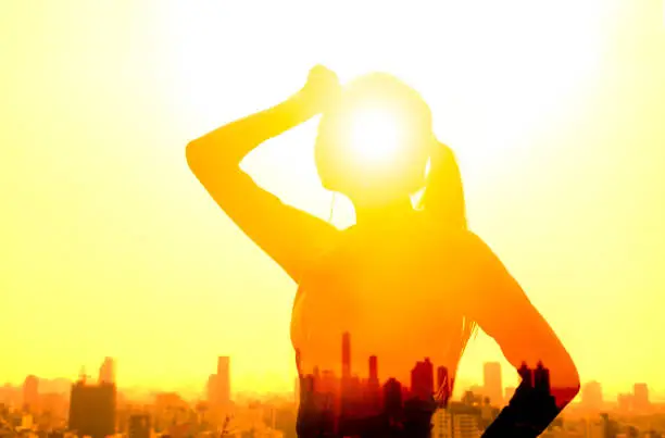 Photo of Double exposure portrait of  young fitness Woman hand wiping sweat and  summer heat wave concept