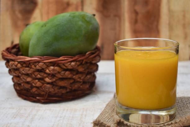 istock Fresh and sweet mango juice. Close up, served in a glass. 1318769907