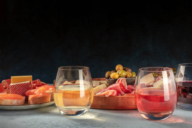 istock Wine, cheese, charcuterie board and salmon sandwiches, a side view 1318774059