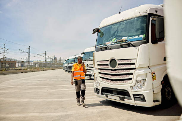istock Black Male Transportation Worker Using Walkie-Talkie 1318776535