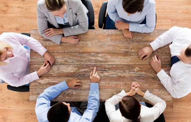 istock close up of business team sitting at table 1318777065