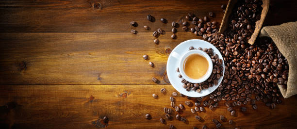 espresso coffee and coffee beans with scoop and jute sack on wooden background, top view, space for text. - caffeine free imagens e fotografias de stock