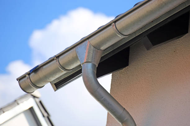 istock Roof gutter on a new tiled roof 1318779354
