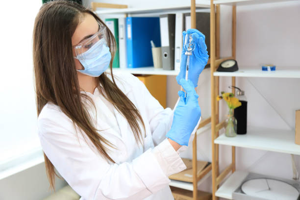 istock Young doctor preparing a vaccine 1318783564