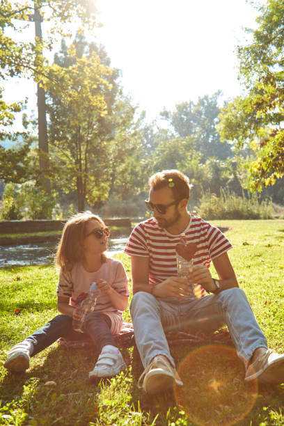 istock Daughter and father enjoying outdoors nature. 1318786186