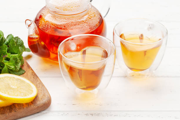 istock Herbal tea with mint and lemon. Tea cup and teapot 1318786320