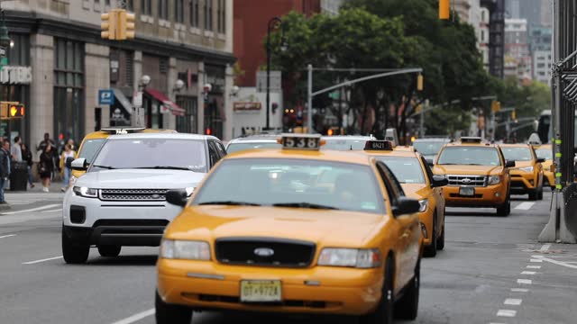 Traffic in NYC, Manhattan and People Crossing Street. Traffic and Cabs, Public Transport Background