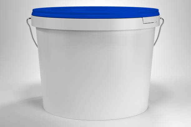istock Blank white paint bucket with handle and blue lid on white neutral background front view 1318792746