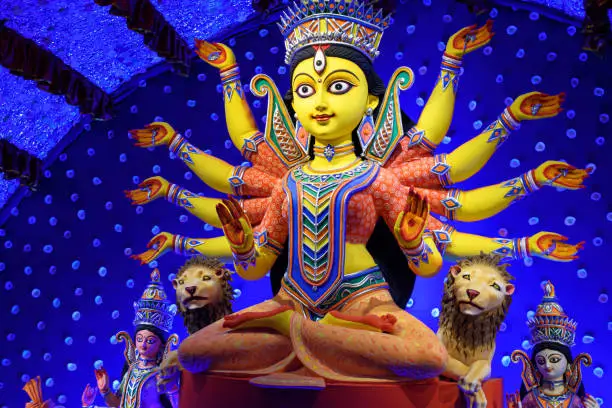 Goddess Durga idol decorated at puja pandal in Kolkata, West Bengal, India. Durga Puja is biggest religious festival of Hinduism and is now celebrated worldwide.