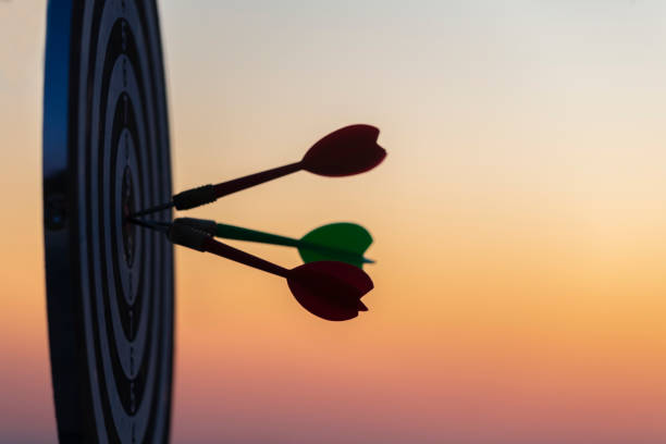 istock Close up shot red darts arrows in the target center 1318799656