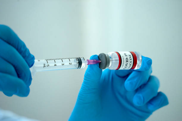 istock Close up  vaccine bottle is on the table in preparation to be administered 1318801384