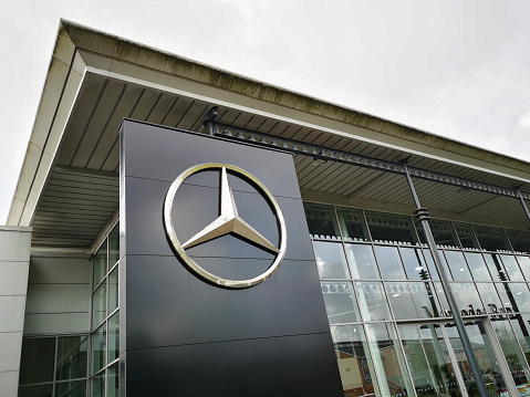 Swansea, UK: May 18, 2021: Mercedes showroom with logo. Mercedes-Benz, commonly referred to as Mercedes is known for producing luxury vehicles and commercial vehicles. The headquarters is in Stuttgart, Baden-Württemberg.