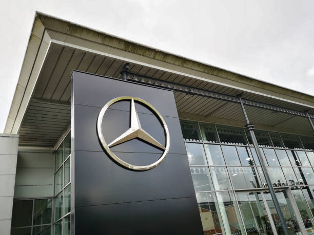 Mercedes Showroom with Logo - UK Swansea, UK: May 18, 2021: Mercedes showroom with logo. Mercedes-Benz, commonly referred to as Mercedes is known for producing luxury vehicles and commercial vehicles. The headquarters is in Stuttgart, Baden-Württemberg. mercedes benz photos stock pictures, royalty-free photos & images